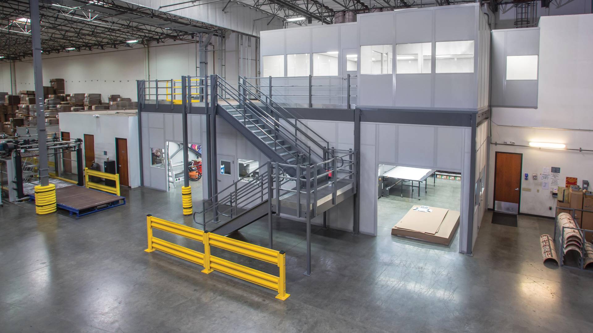 A yellow mezzanine in a warehouse