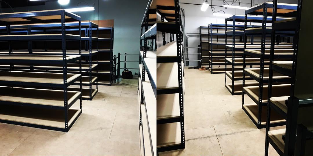 steel industrial shelving holding warehouse materials