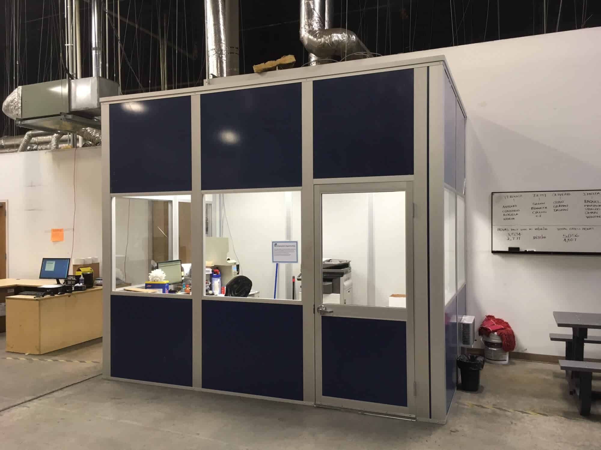 a modular office inside of a warehouse