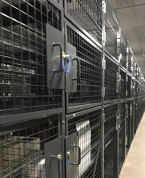 floor to ceiling row of wire security lockers
