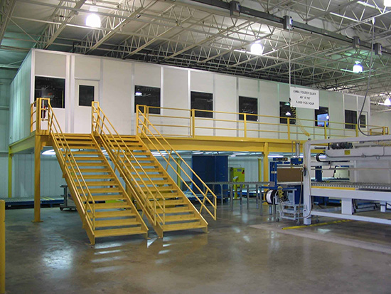 a multi-story modular inplant office with two sets of staircases to the second floor