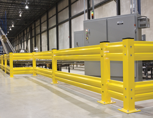 safety guard railing around electrical equipment in a warehouse